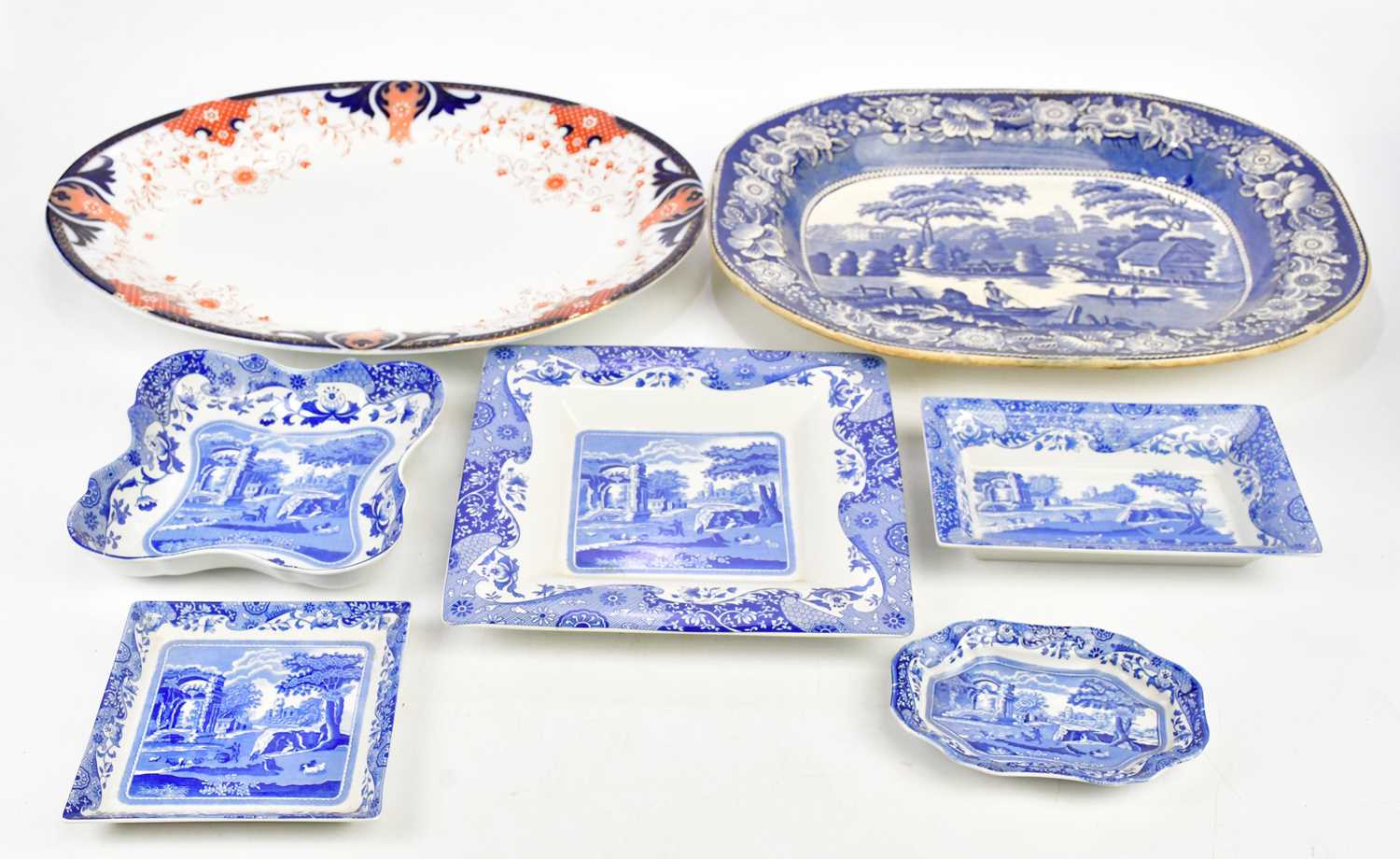 A Victorian blue and white meat plate decorated with a river scene, length 45cm, a further meat