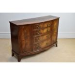 A reproduction mahogany bowfront sideboard with four drawers flanked by single panelled cupboard