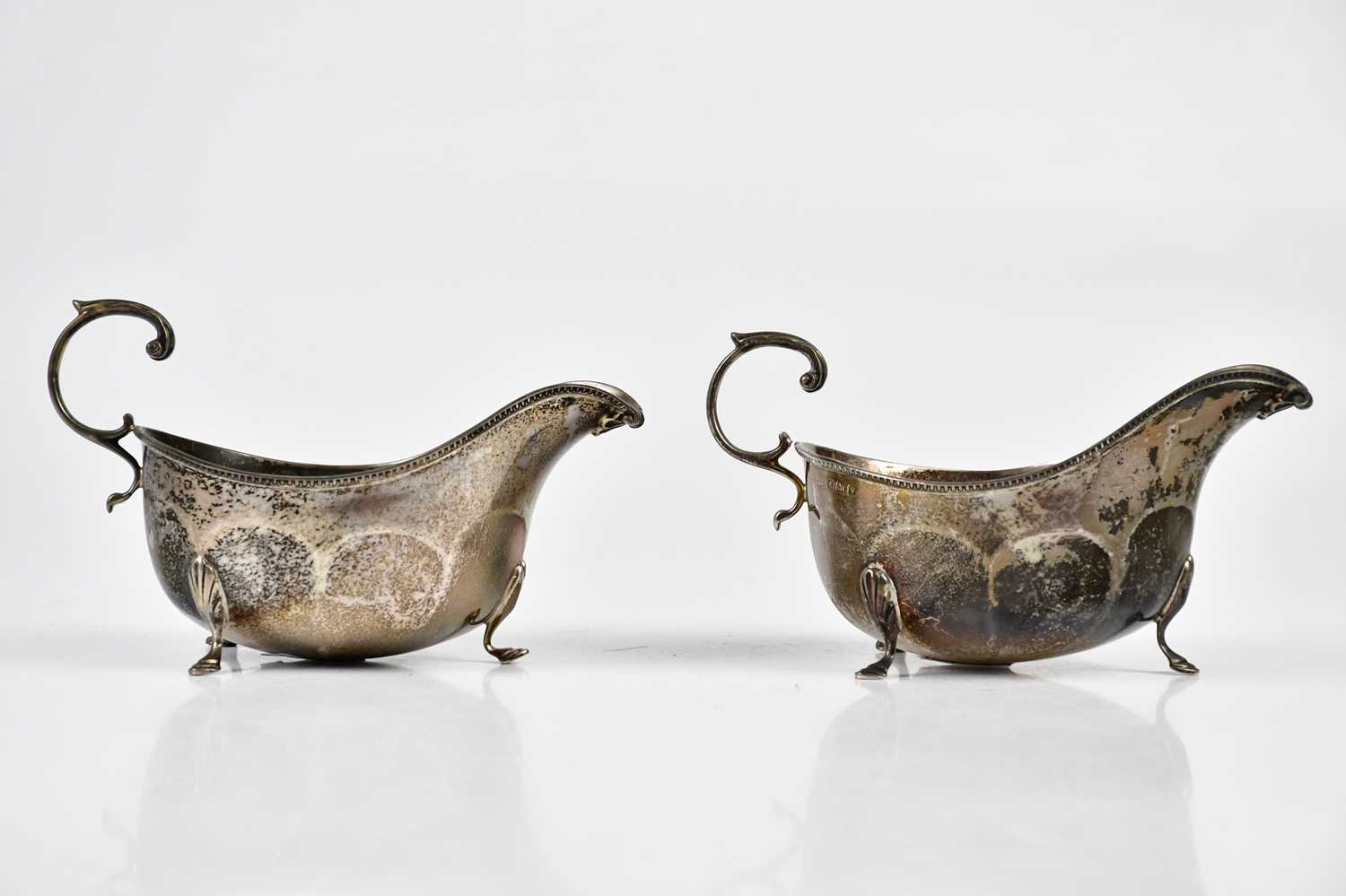 BARNSLEY & CO; a pair of George V hallmarked silver sauce boats, Birmingham 1920, weight 7ozt /