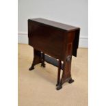 An Edwardian inlaid mahogany drop-leaf Sutherland table, with applied roundels in the manner of