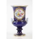 MEISSEN; a cobalt blue ground twin handled vase, with hand painted floral decoration, height 13cm.