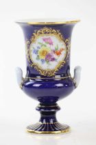 MEISSEN; a cobalt blue ground twin handled vase, with hand painted floral decoration, height 13cm.