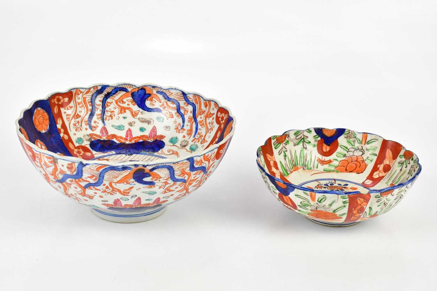 An early 20th century Japanese Imari pattern bowl, diameter 28cm, together with a further smaller