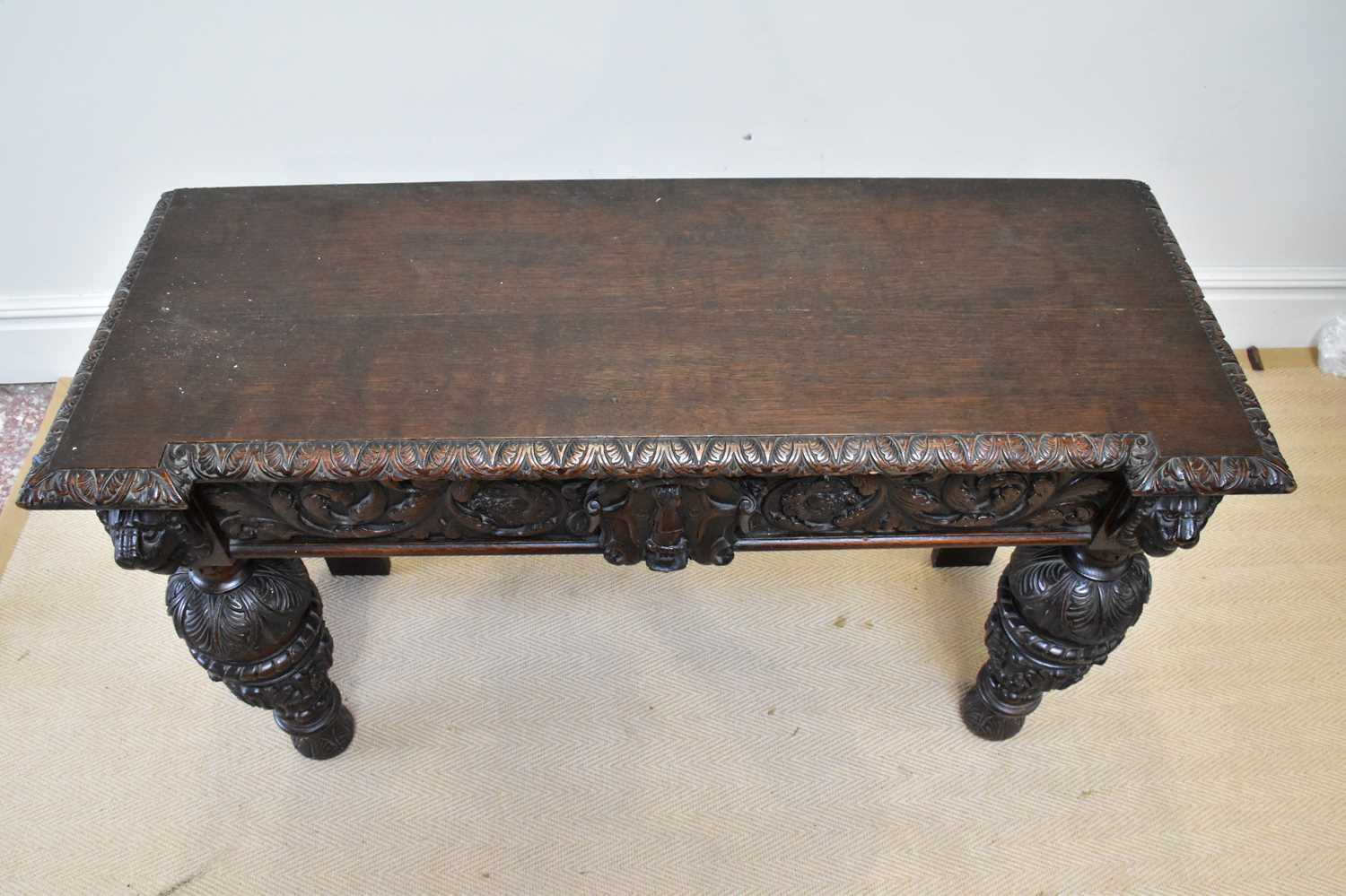 A 19th century Flemish style carved oak side table, height 88cm, width 121cm, depth 47cm. - Image 4 of 4