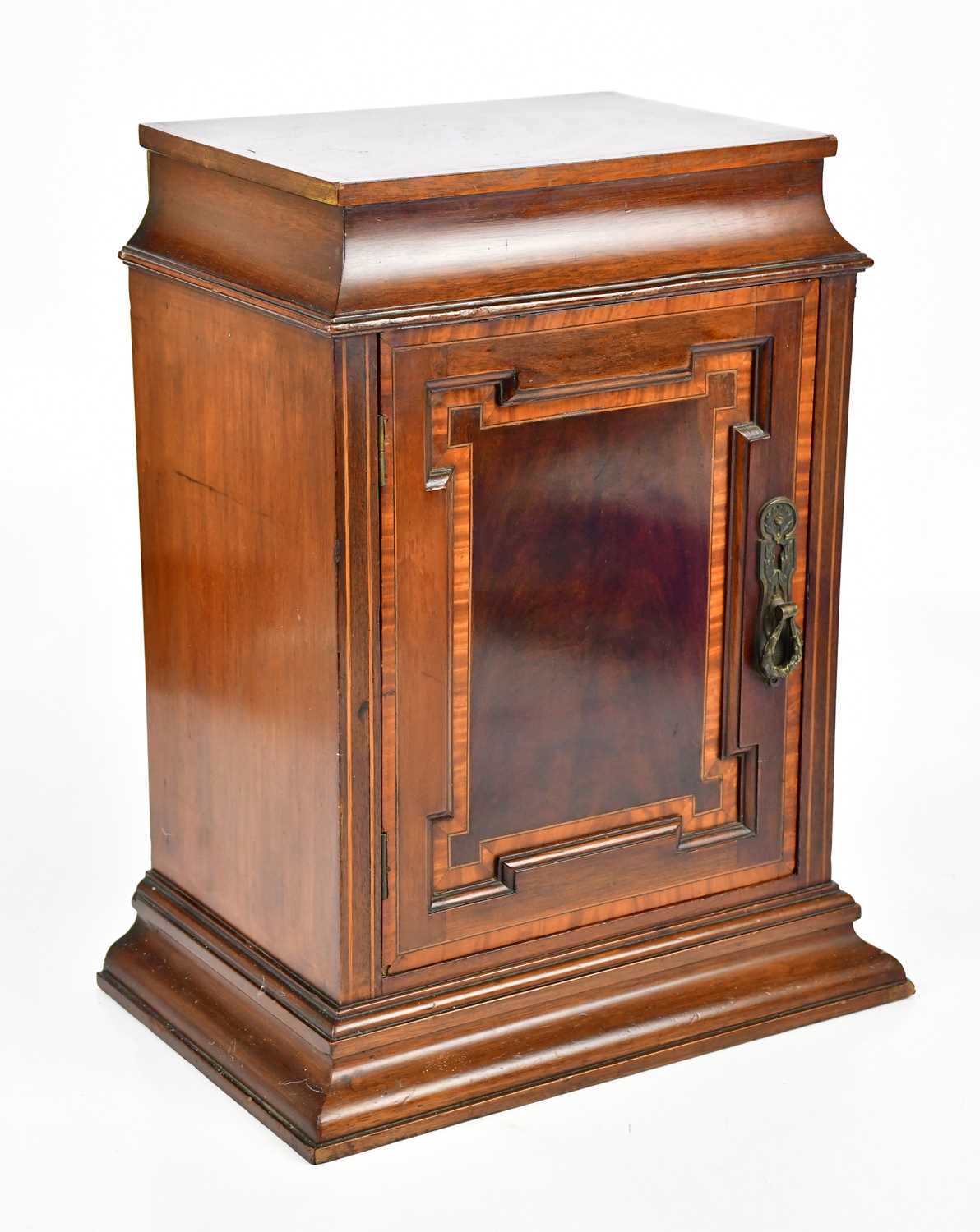 An Edwardian inlaid mahogany Sheraton Revival cabinet with single panelled door enclosing fixed