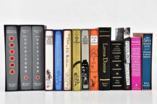 A small collection of Folio Society books comprising ‘The Deceivers’ Vol 1 and 2, ‘Enigma’, ‘The