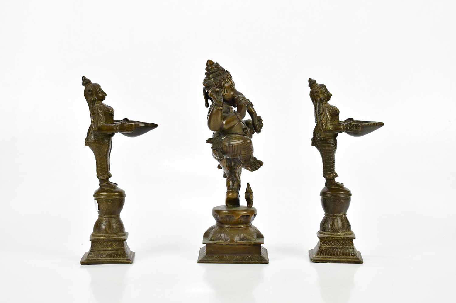 A bronze figure of Ganesh, together with a pair of bronze wick lamps, height of largest 29cm. - Image 6 of 8