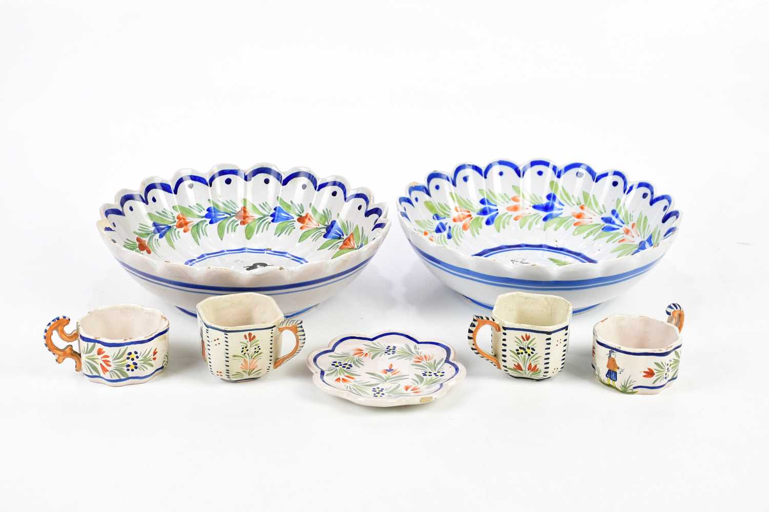 QUIMPER; a small selection of ceramics including a scalloped edge bowl, tea cups, etc.