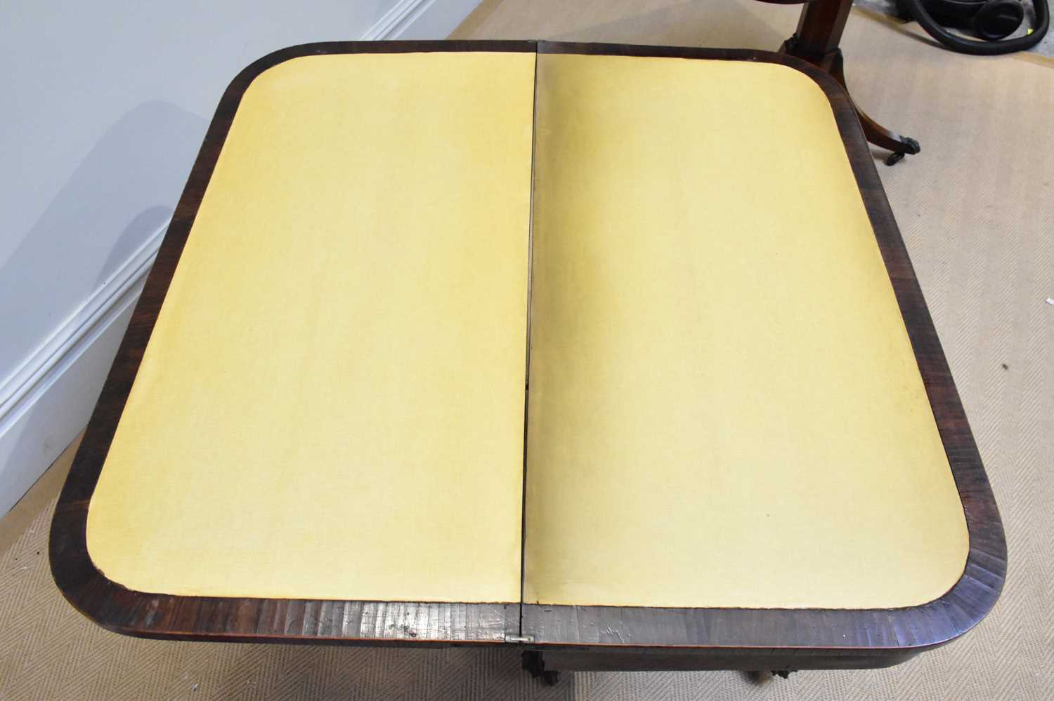 A near pair of Regency rosewood card tables, each with a swivel top on an octagonal column and - Image 2 of 4