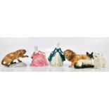 BESWICK; a collection of four figures comprising West Highland terrier, lion, cat and cougar,