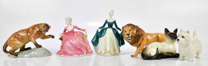 BESWICK; a collection of four figures comprising West Highland terrier, lion, cat and cougar,