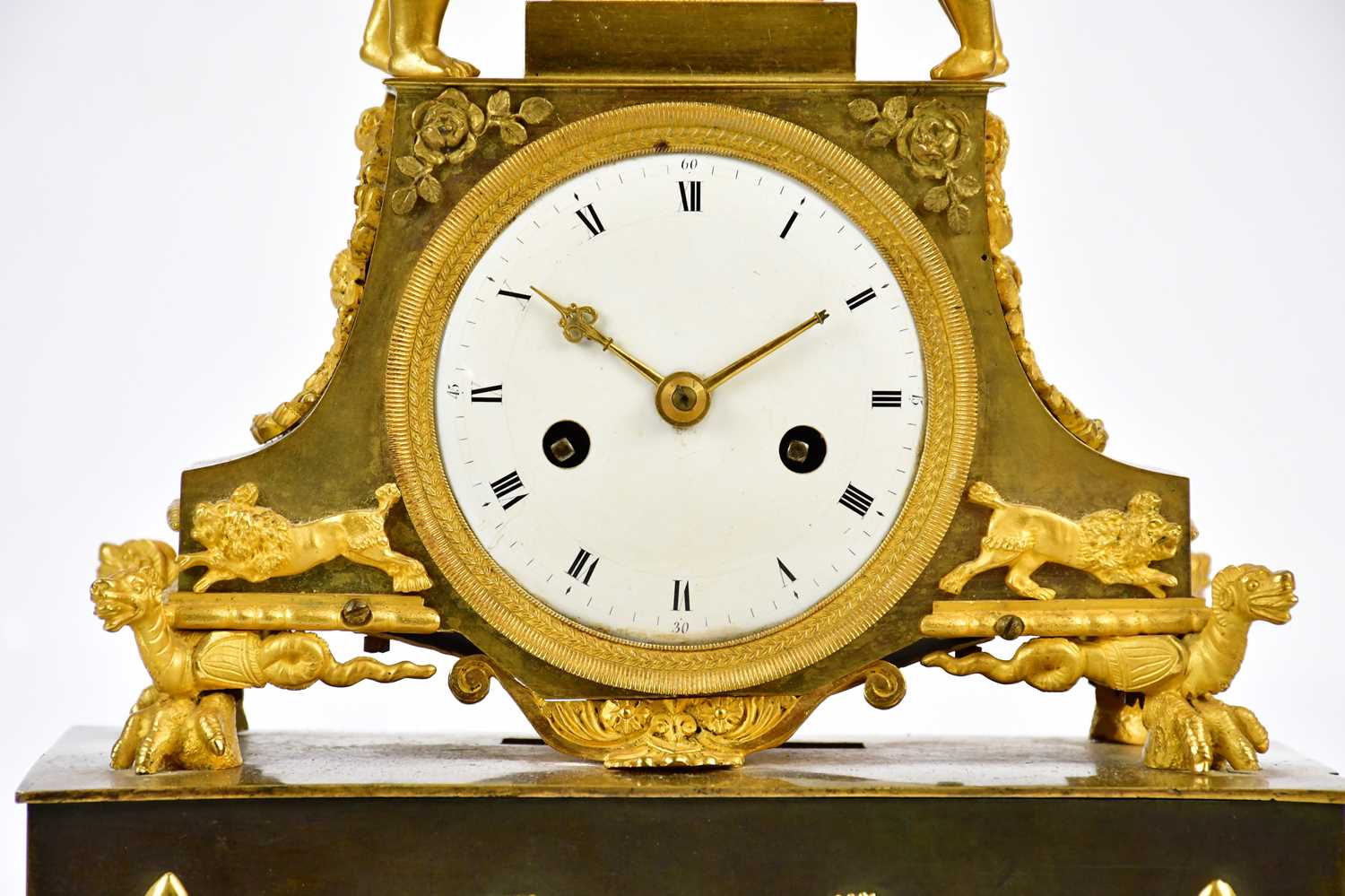 A late 19th century French ormolu mantel clock with cherubs supporting an urn finial above the - Image 2 of 7