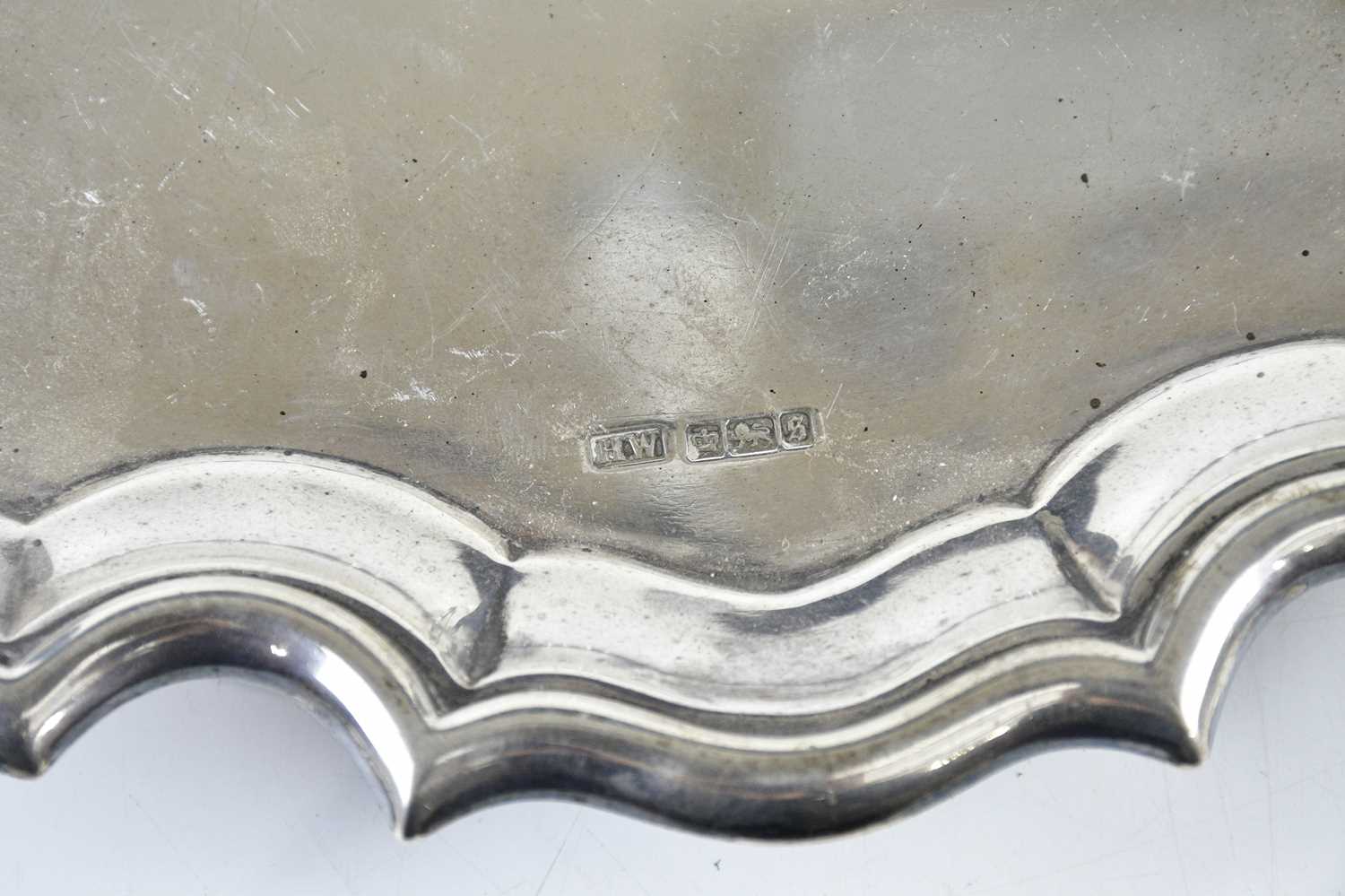 LEE & WIGFULL; a George V hallmarked silver salver with pie crust edge and central family crest, - Image 4 of 4