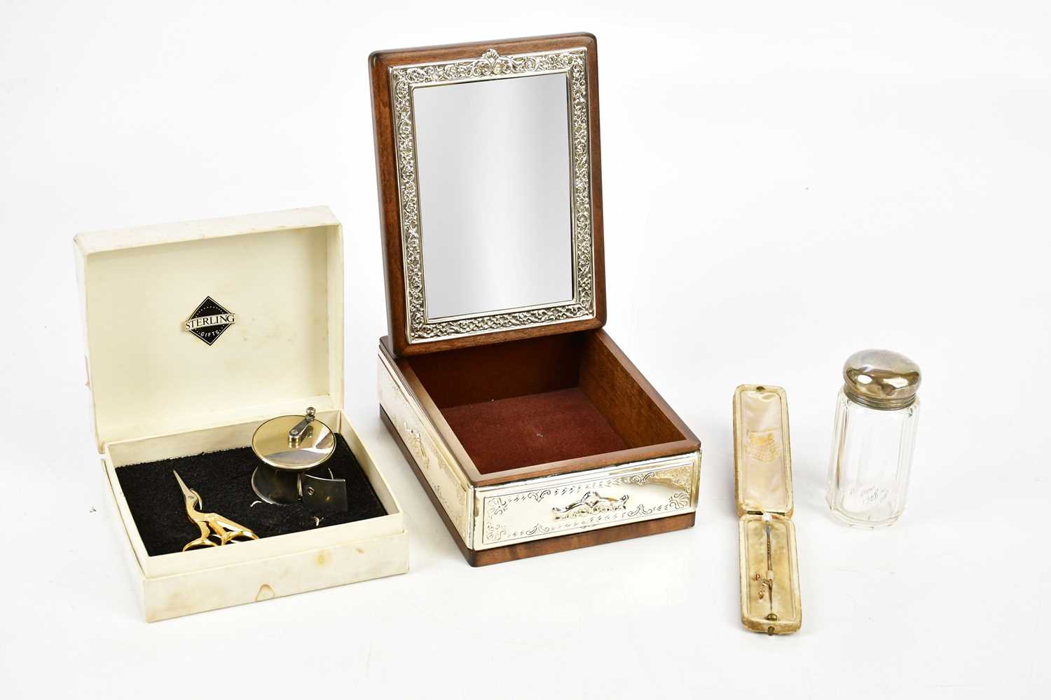 A contemporary sterling silver mounted jewellery casket, a glass top dressing table bottles with