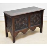 A carved oak coffer with lozenge and floral decoration, length 103cm, height 71cm.