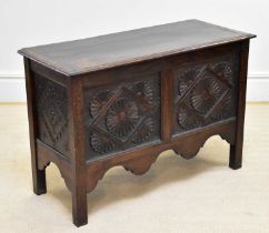 A carved oak coffer with lozenge and floral decoration, length 103cm, height 71cm.