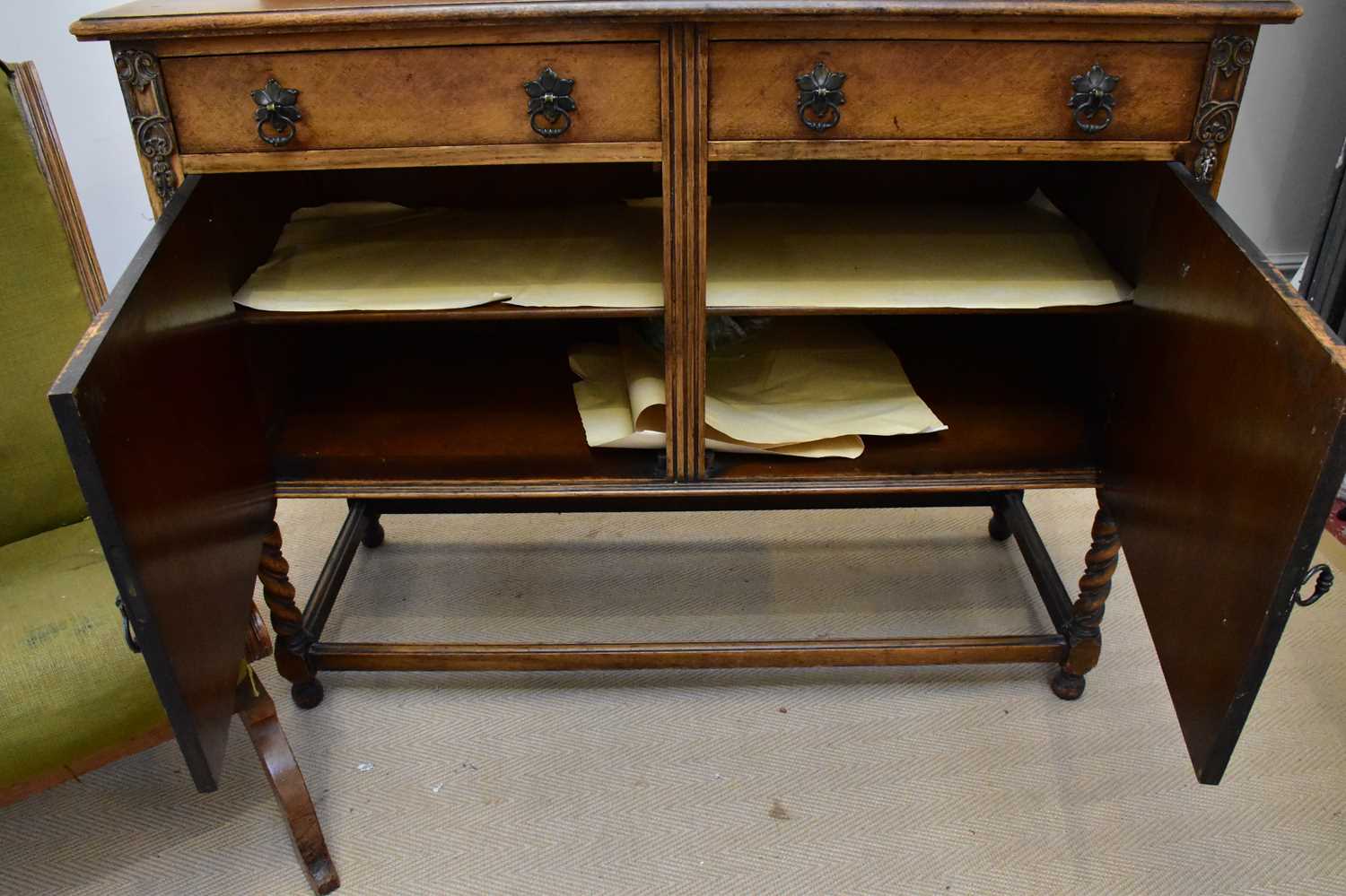 An early 20th century oak sideboard, with two drawers above two panelled cupboard doors, on bun - Image 3 of 3
