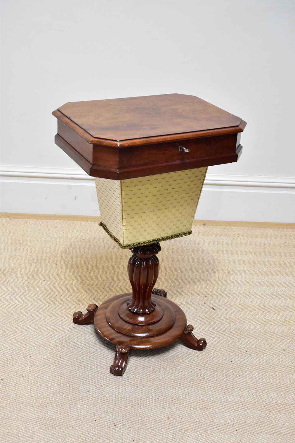 A William IV mahogany sewing table of shaped rectangular form, with undertier basket, on fluted