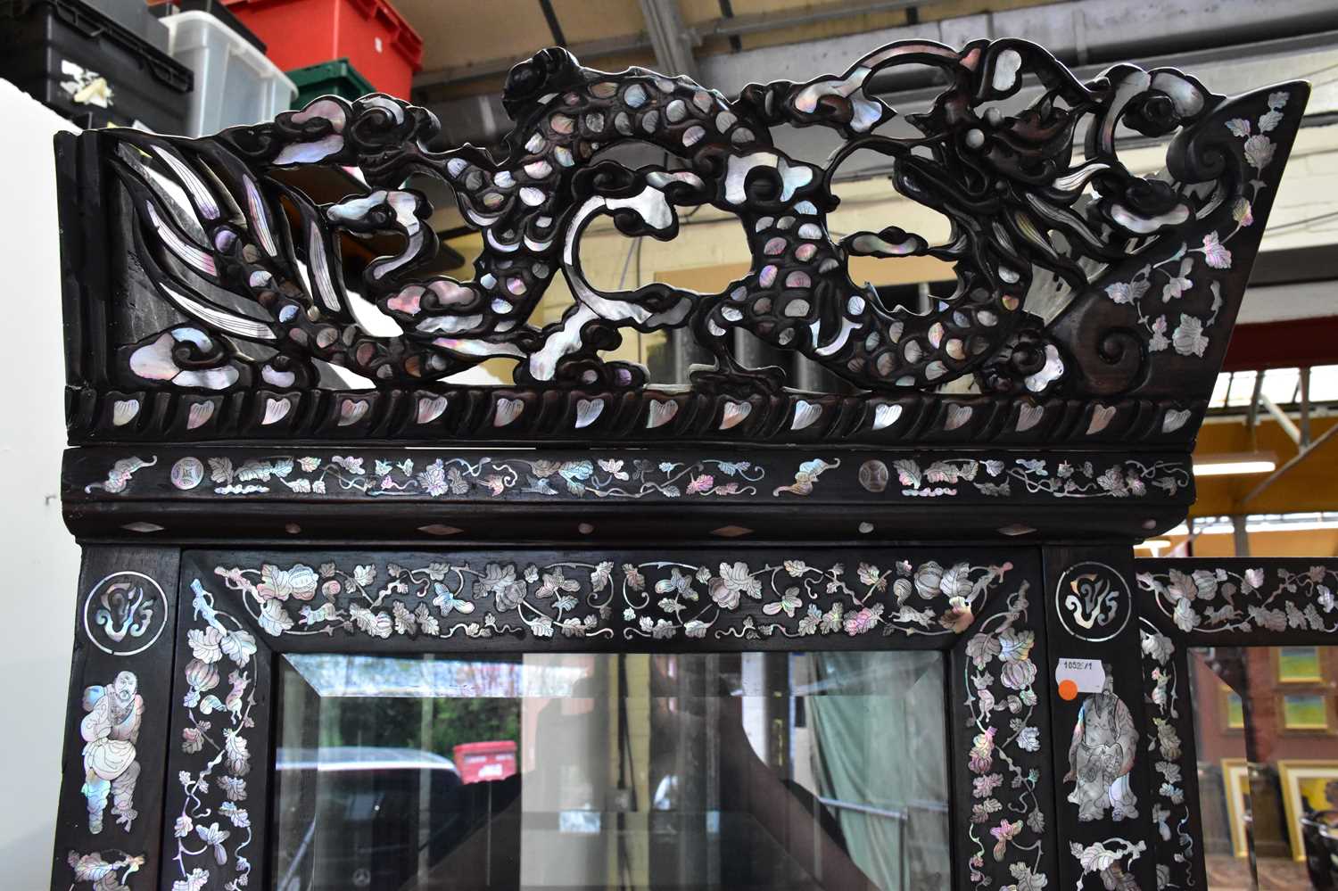 A Chinese ebonised carved display cabinet with mother of pearl inlaid decoration depicting - Image 5 of 13