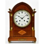 S SMITH & SONS LTD, LONDON; an Edwardian inlaid mahogany arch topped mantel clock with four brass