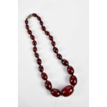 A cherry amber beaded necklace, length 43cm, approximate weight 44.4g. Condition Report: As