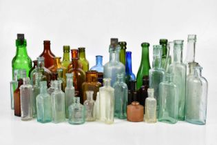 A collection of sauce and poison bottles to include some named examples.