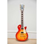 A Gibson style Les Paul custom electric guitar, serial number 01433746, together with Gibson case