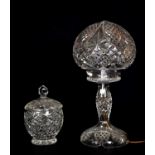 A cut glass lamp and shade, together with a cut glass jar and cover, height 40cm. Condition
