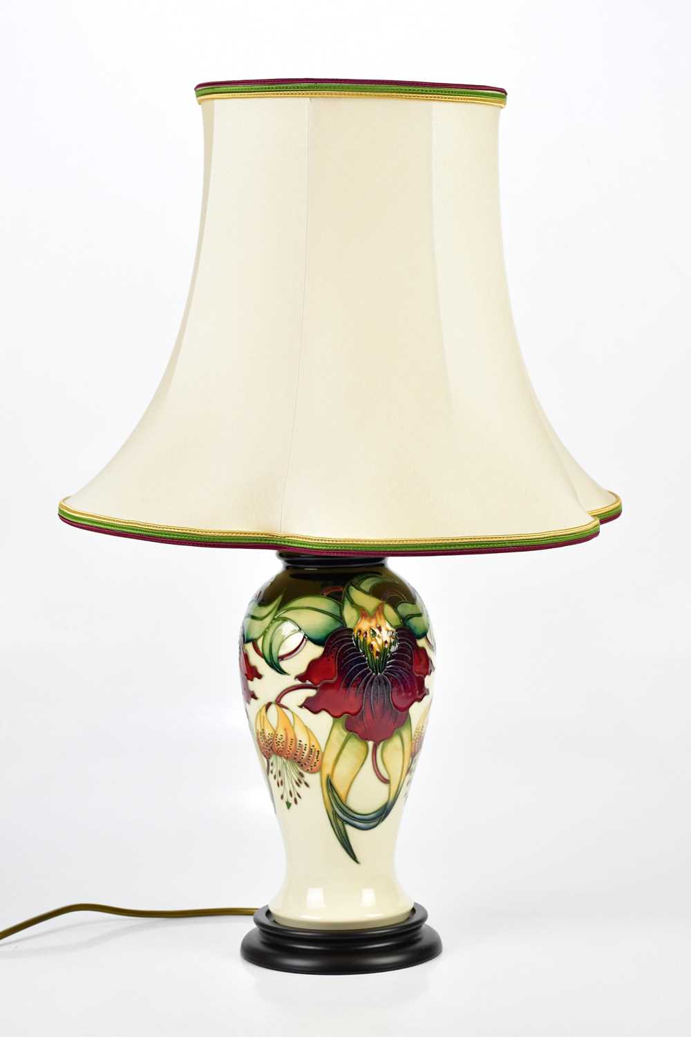 MOORCROFT; an 'Anna Lily' pattern lamp, height 38cm. Condition Report: The item or items in this lot