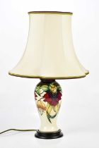 MOORCROFT; an 'Anna Lily' pattern lamp, height 38cm. Condition Report: The item or items in this lot