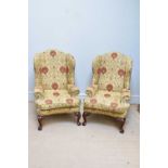 A pair of 19th century large wingback armchairs, with shell carved cabriole legs, height 122cm.