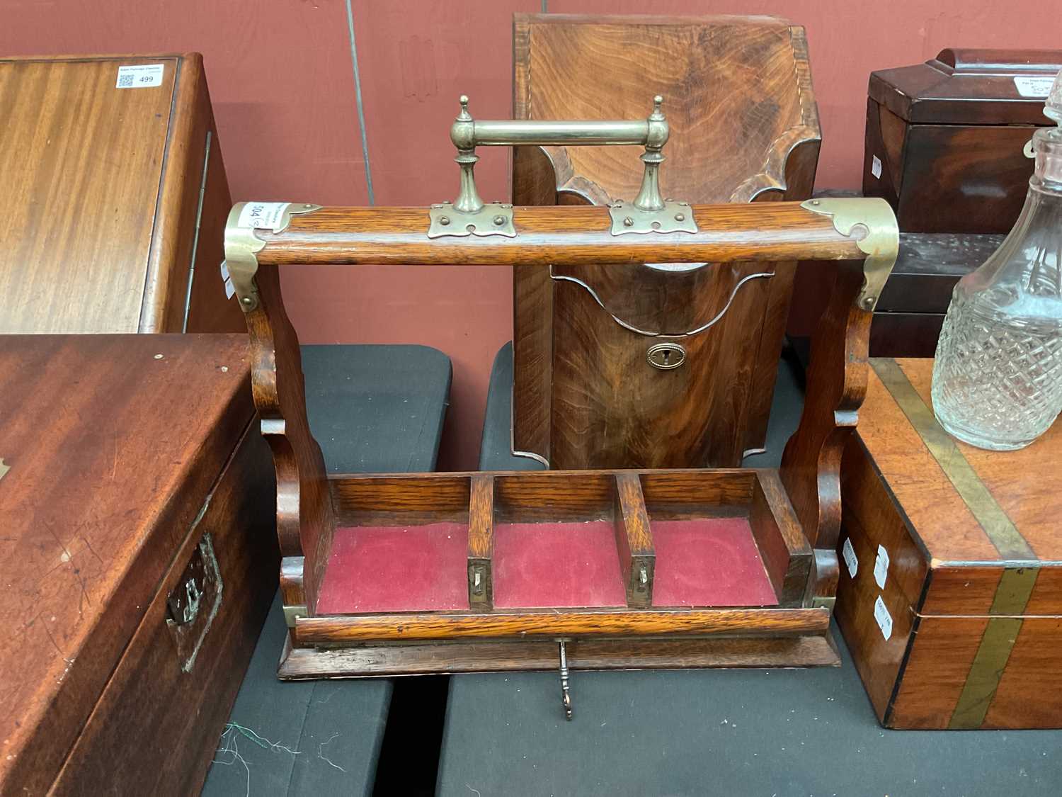 An early 20th century oak tantalus with silver plated mounts, housing three associated moulded glass - Image 6 of 6