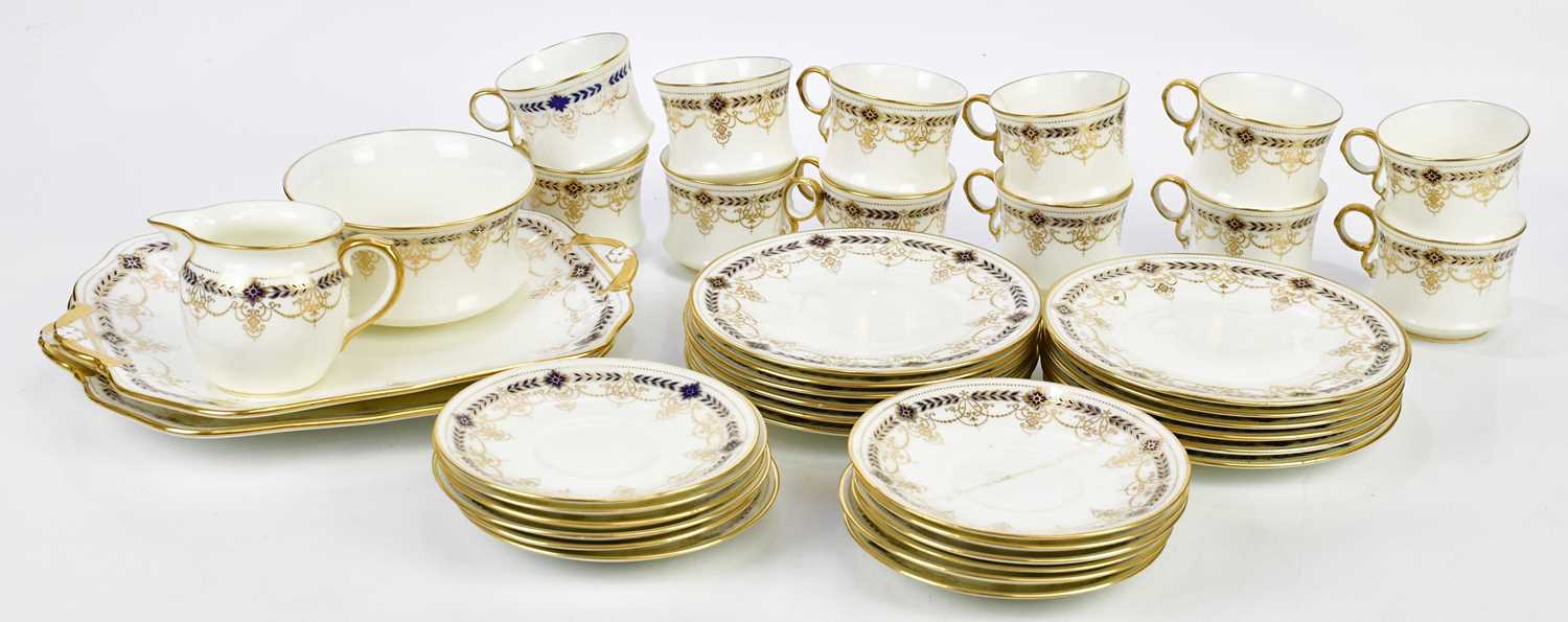 CAULDON; a part tea service with gilt and cobalt blue decoration.