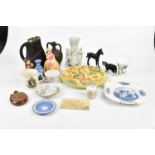 A small collection of ceramics to include Wedgwood jasperware, Royal commemorative mugs, a Hummel