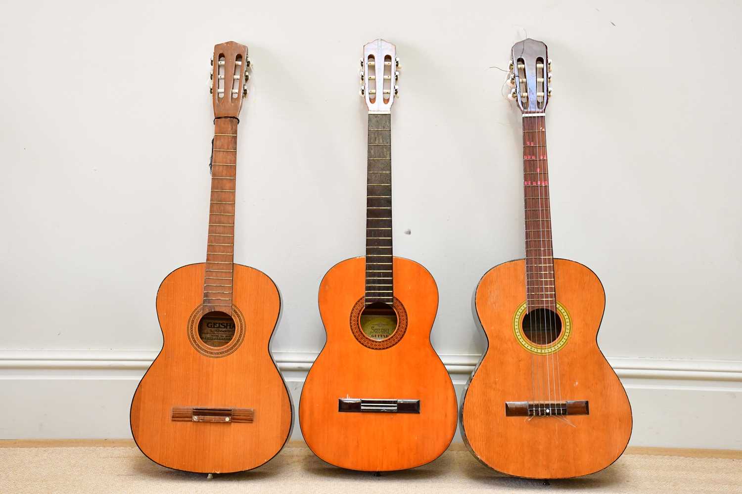 SUZUKI; a six string acoustic guitar, together with a Terada acoustic guitar and a Geisha acoustic