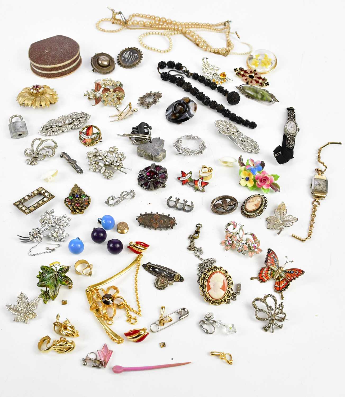 A collection of assorted costume jewellery including Victorian white metal brooches, one
