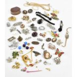 A collection of assorted costume jewellery including Victorian white metal brooches, one