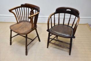 An early 20th century stained oak and beech office chair with leatherette seat, on turned legs,