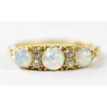 A Victorian yellow metal opal and diamond set dress ring, size J, approx weight 3g.