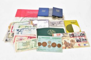 A collection of coins in packs including Isle of Man, Guernsey, first decimal coins etc, also a