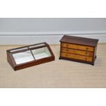 A late Victorian mahogany table top cabinet with hinged door, length 61cm and a threee drawer