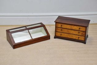 A late Victorian mahogany table top cabinet with hinged door, length 61cm and a threee drawer