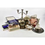 A quantity of electroplated items to include cutlery, a rose bowl, a candlestick, bottle coasters,