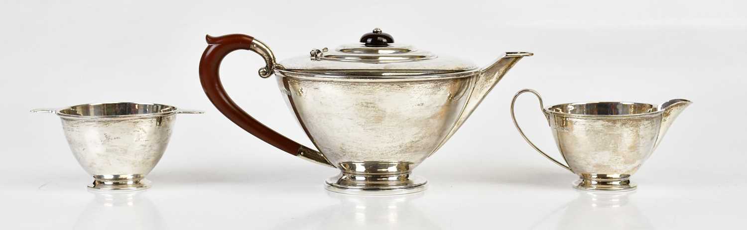 HENRY CLIFFORD DAVIS; a hallmarked silver George VI three piece tea service, Birmingham 1939, approx