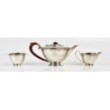 HENRY CLIFFORD DAVIS; a hallmarked silver George VI three piece tea service, Birmingham 1939, approx