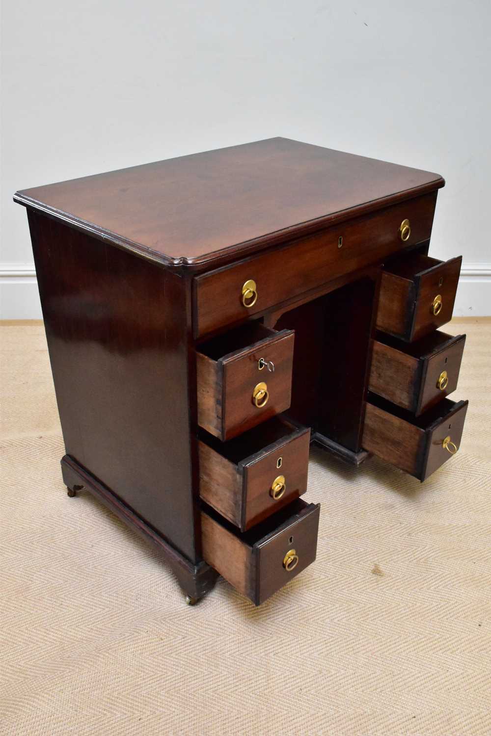 A George III mahogany kneehole desk, the seven drawers with later handles around a central - Image 3 of 4