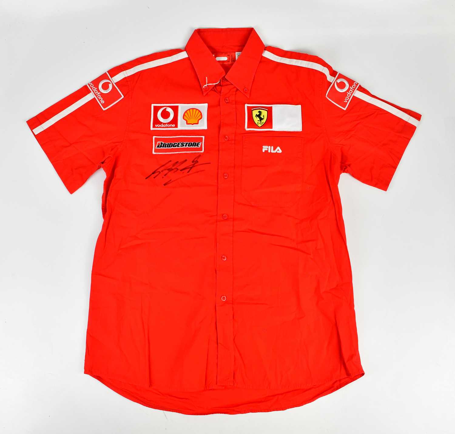 MICHAEL SCHUMACHER; a signed FILA Ferrari shirt, signed to the front, size XL. Condition Report: