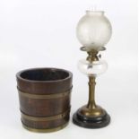 A 20th century brass oil lamp with replacement frosted glass shade and clear glass reservoir, height
