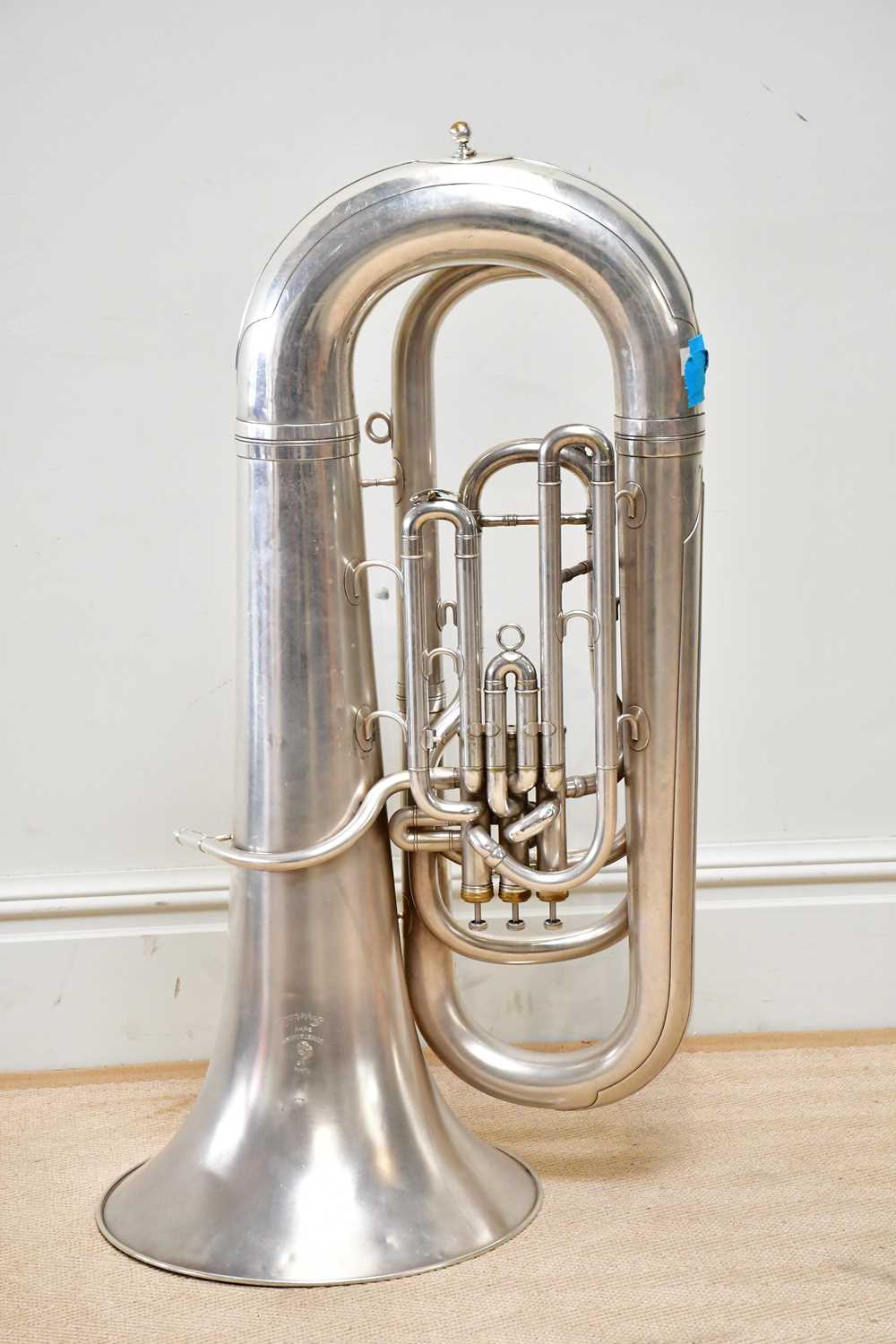 BOOSEY & HAWKES; an Imperial tuba, numbered 584759, with two mouth pieces, stand and accessories.