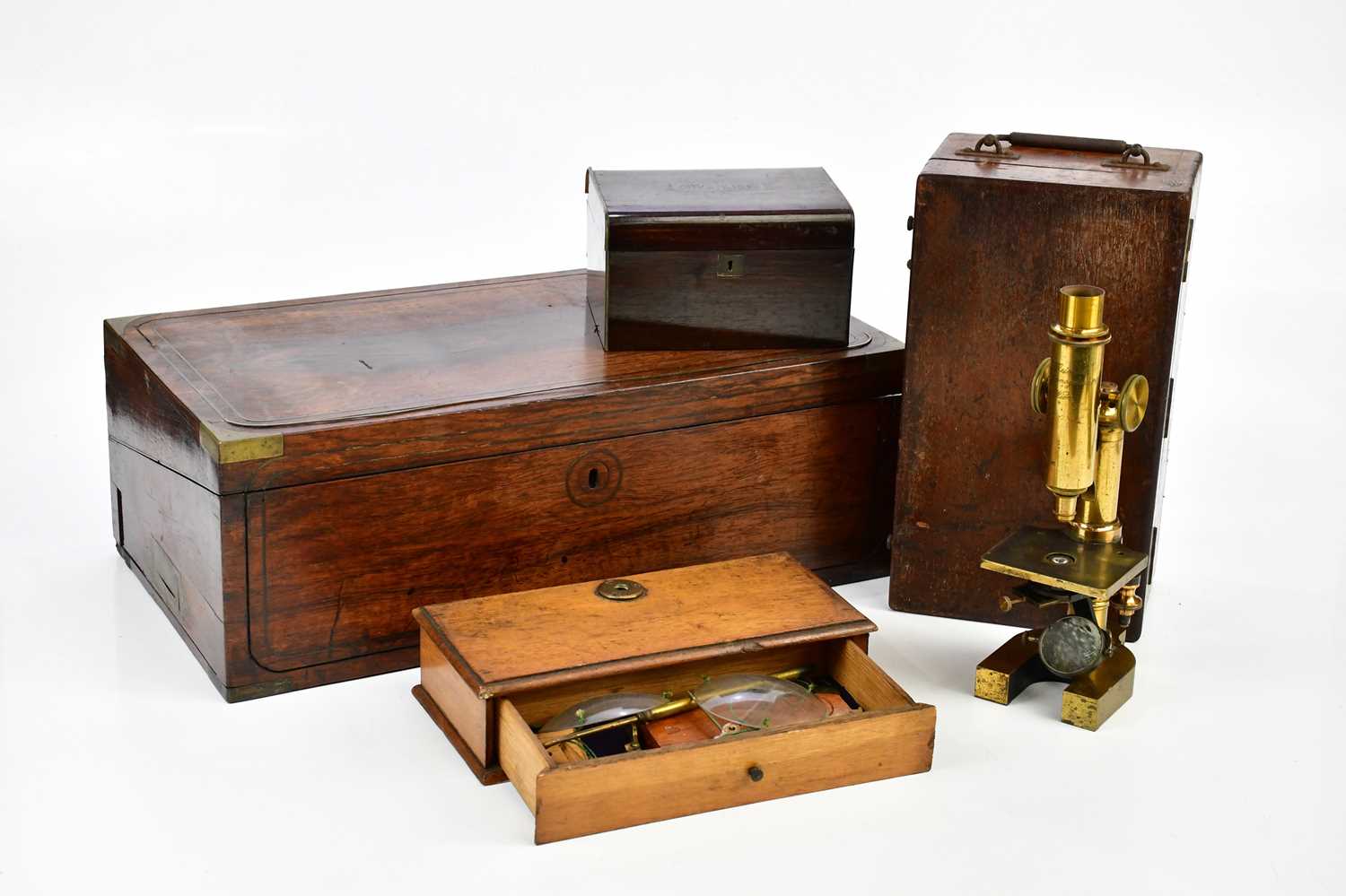 G REICHERT, VIENNA; a brass lacquered microscope with lenses, a 19th century brass bound campaign